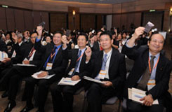 Kick off! Officiating guests light up iconic replicas while participants wave shiny bookmarks to open the 6th CIIF Forum