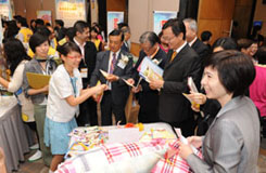 Volunteers of the project expo introduce their project panels to the judges for the “Most Effective Display Award”.